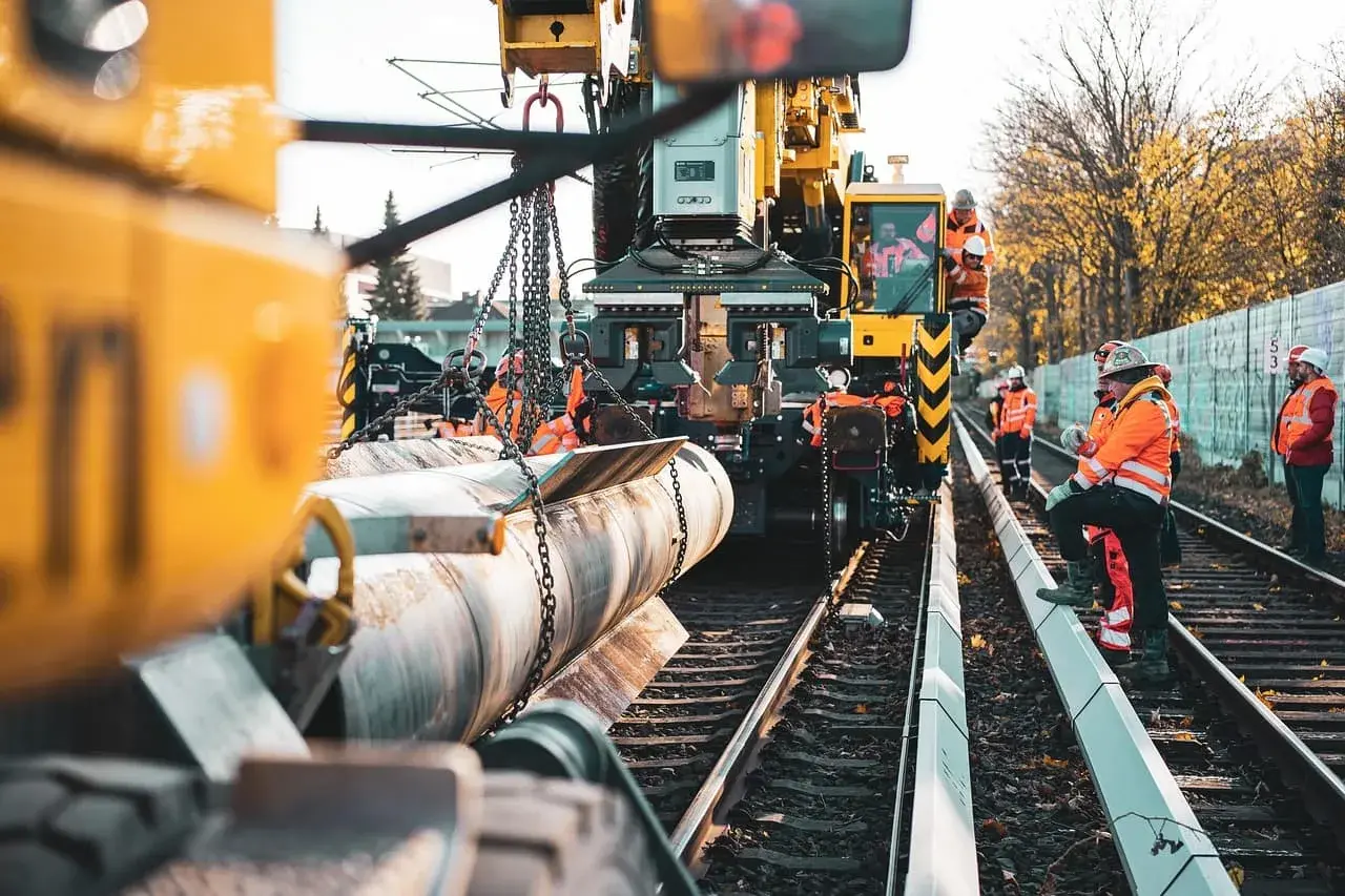 Workers installing pipe on the job — the businesses we serve